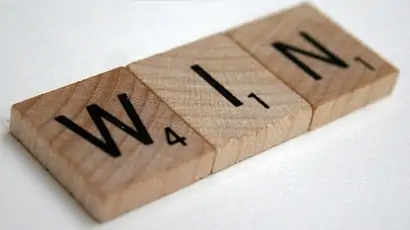 A Facebook Game Like Scrabble with the Psychological Challenges of Poker